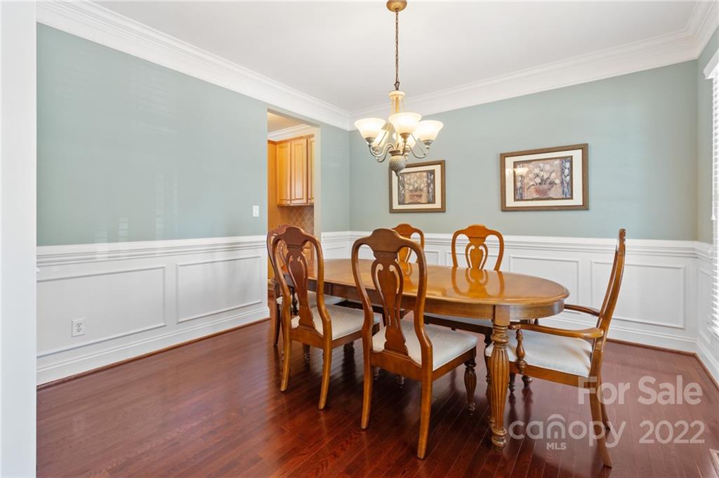 389 Third Baxter Street Fort Mill, SC 29708 - Photo 10 of 48 a view of a dining room with furniture wooden floor and chandelier