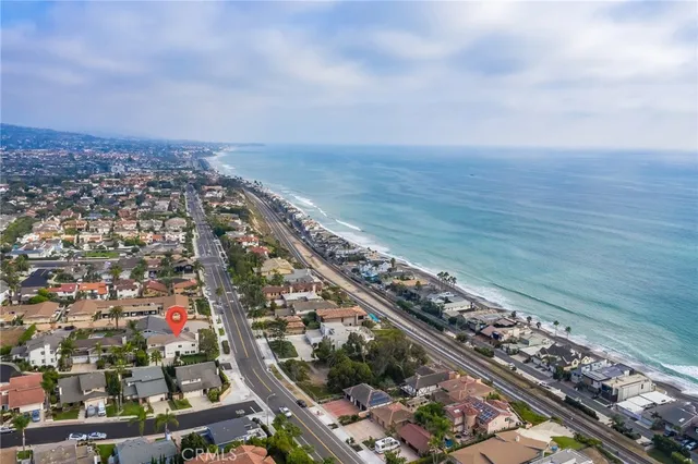 a aerial view of a house with a yard and plants