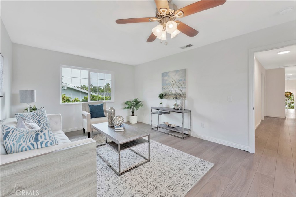 27282 Via Bella Dana Point, CA 92624 - Photo 23 of 50 a living room with furniture and a wooden floor