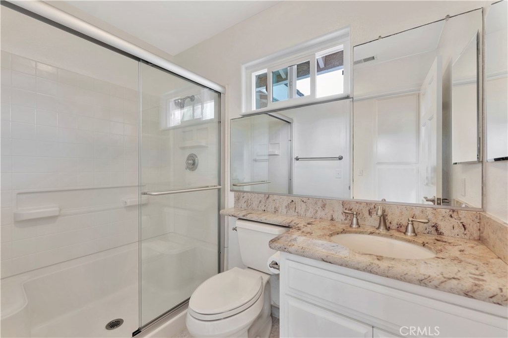 27282 Via Bella Dana Point, CA 92624 - Photo 25 of 50 a bathroom with a granite countertop sink a toilet and shower