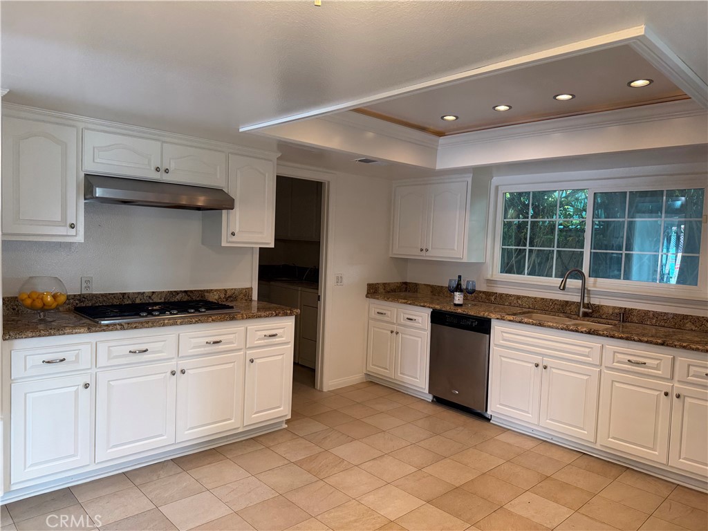 27282 Via Bella Dana Point, CA 92624 - Photo 32 of 50 a kitchen with a sink and cabinets