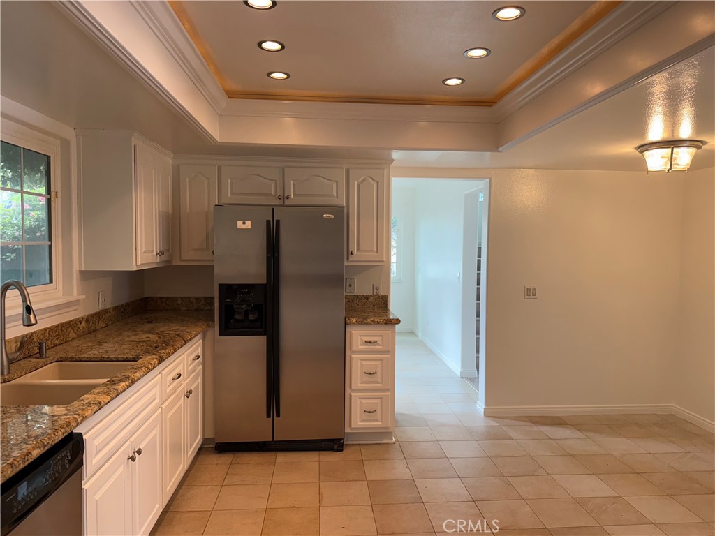 27282 Via Bella Dana Point, CA 92624 - Photo 33 of 50 a large kitchen with stainless steel appliances granite countertop a refrigerator and a sink