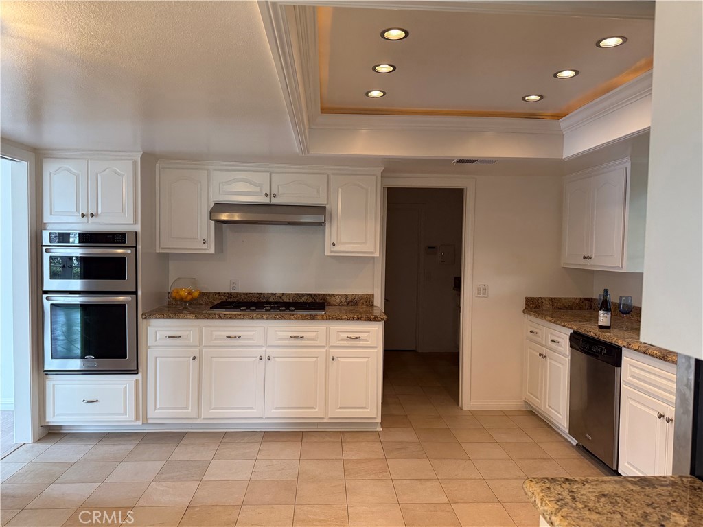 27282 Via Bella Dana Point, CA 92624 - Photo 35 of 50 a kitchen with stainless steel appliances granite countertop a stove a sink and a refrigerator