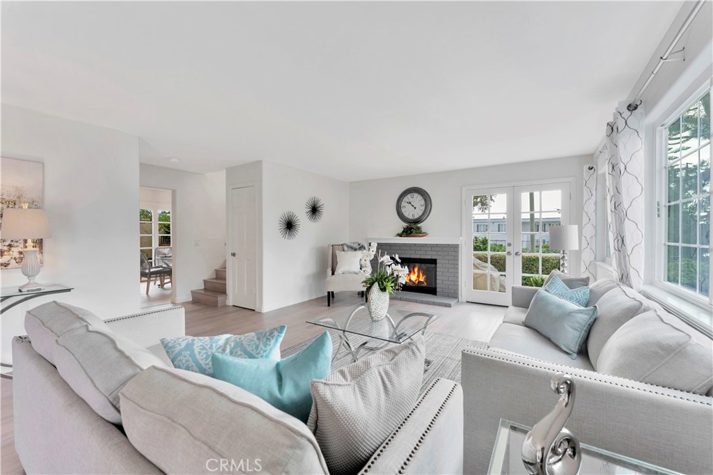 27282 Via Bella Dana Point, CA 92624 - Photo 38 of 50 a living room with furniture and a fireplace