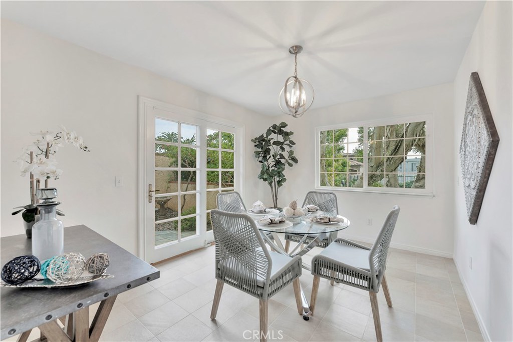 27282 Via Bella Dana Point, CA 92624 - Photo 39 of 50 a view of a dining room with furniture wooden floor and chandelier