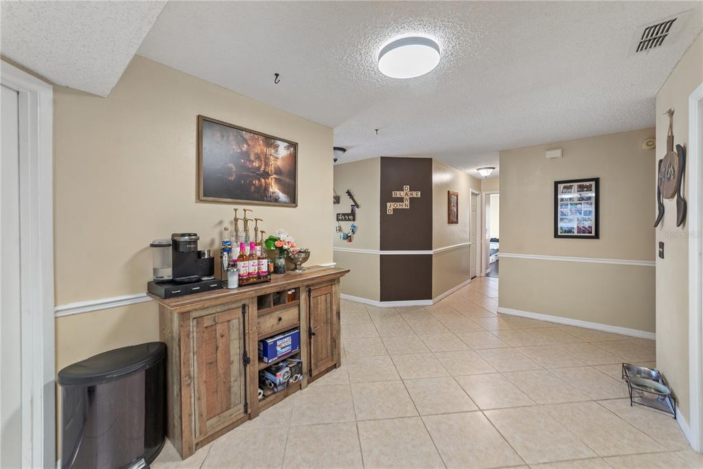 8715 Huntsman Lane Port Richey, FL 34668 - Photo 9 of 54 a kitchen with stainless steel appliances granite countertop a stove and a refrigerator