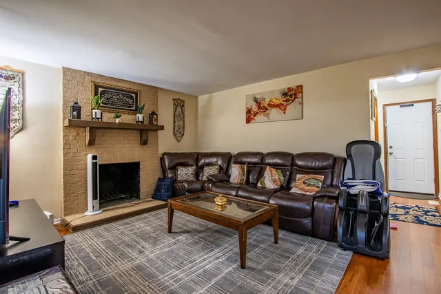 a bathroom with a granite countertop toilet sink and mirror