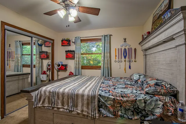 a bedroom with a bed and a tv in it