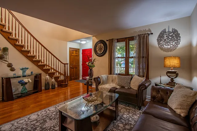 a bathroom with a granite countertop sink and a toilet