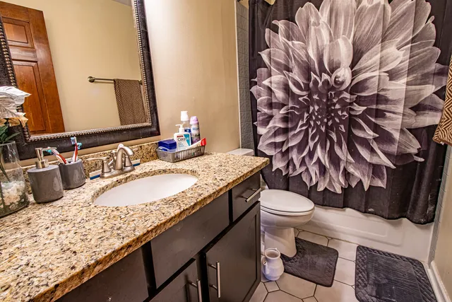 a view of empty room with wooden ceiling
