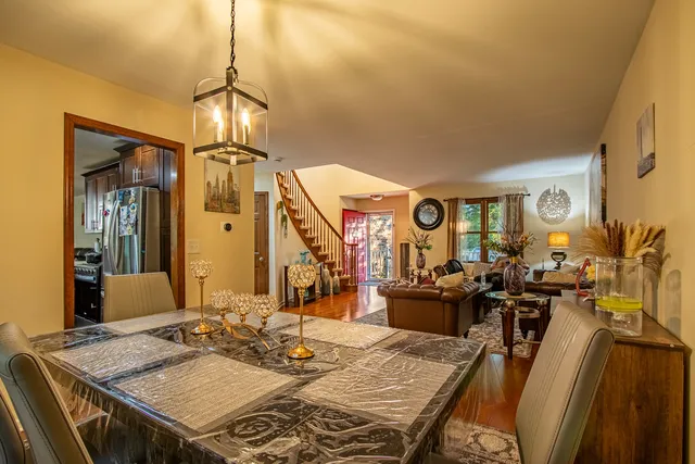 a view of a dining room with furniture window and wooden floor