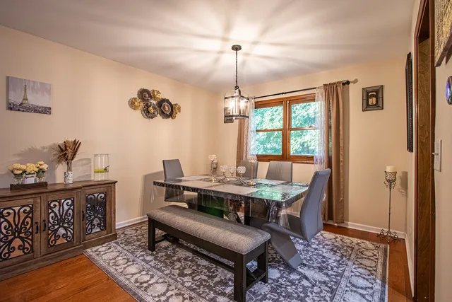 a kitchen with stainless steel appliances kitchen island granite countertop a refrigerator and a stove