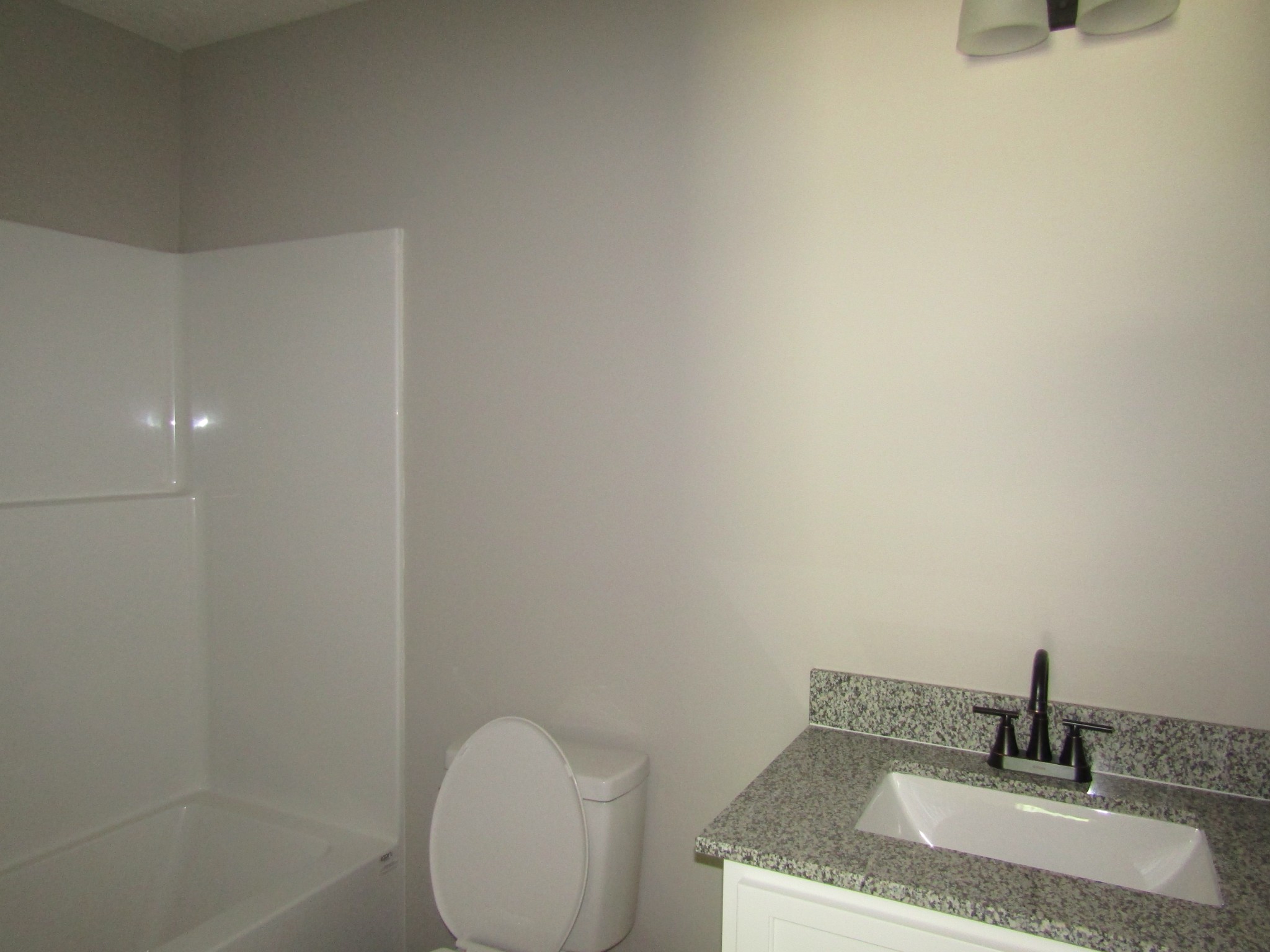 460 Crescent Factory Road Lawrenceburg, TN 38464 - Photo 9 of 13 a bathroom with a granite countertop sink and toilet