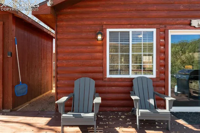 a view of a house with backyard and sitting area