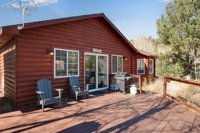 a view of a house with backyard porch and sitting area
