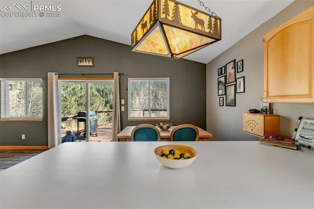 a view of a livingroom with furniture and a window