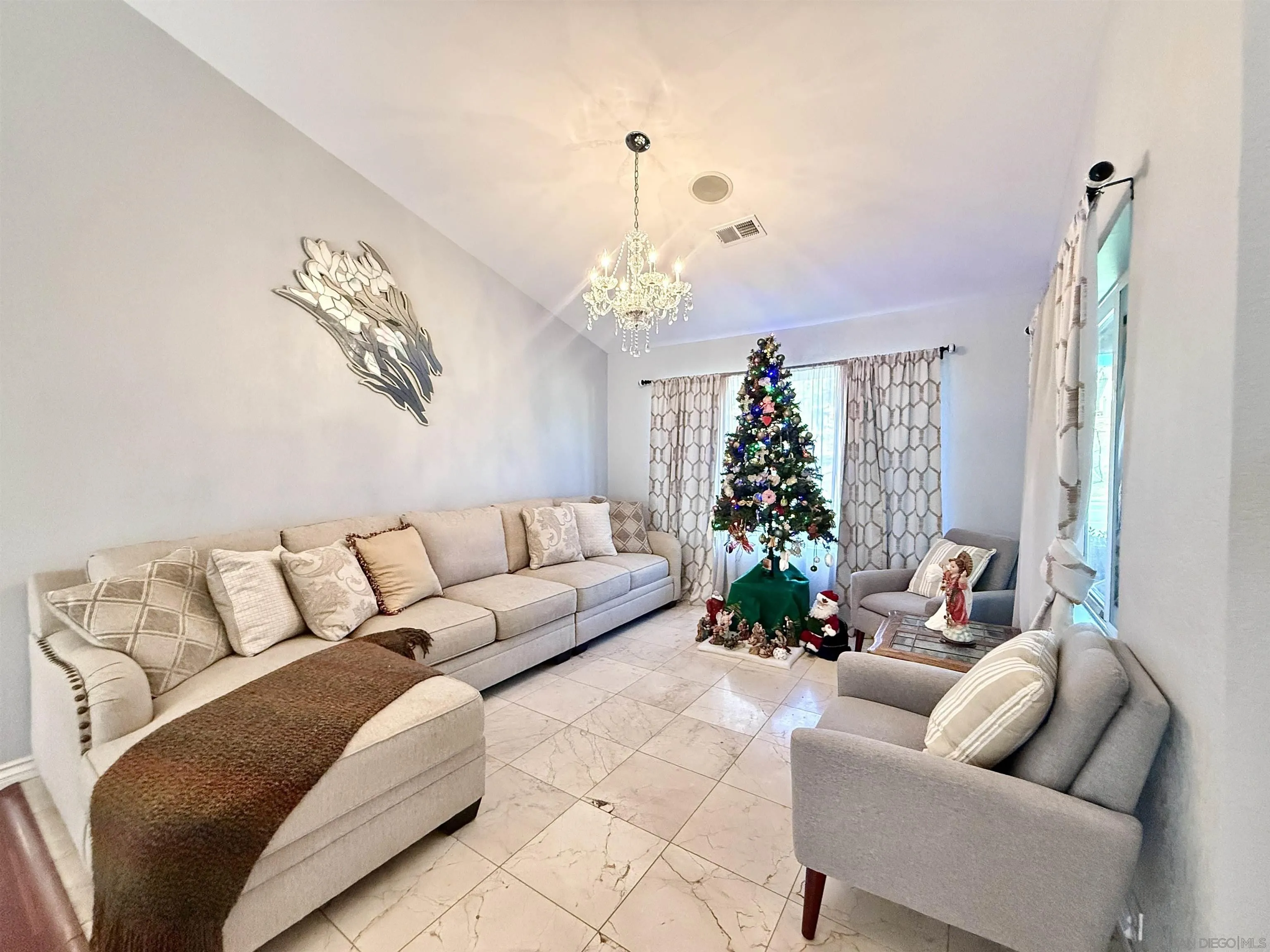 1423 Vista Grande Road El Cajon, CA 92019 - Photo 11 of 25 a living room with furniture and a chandelier