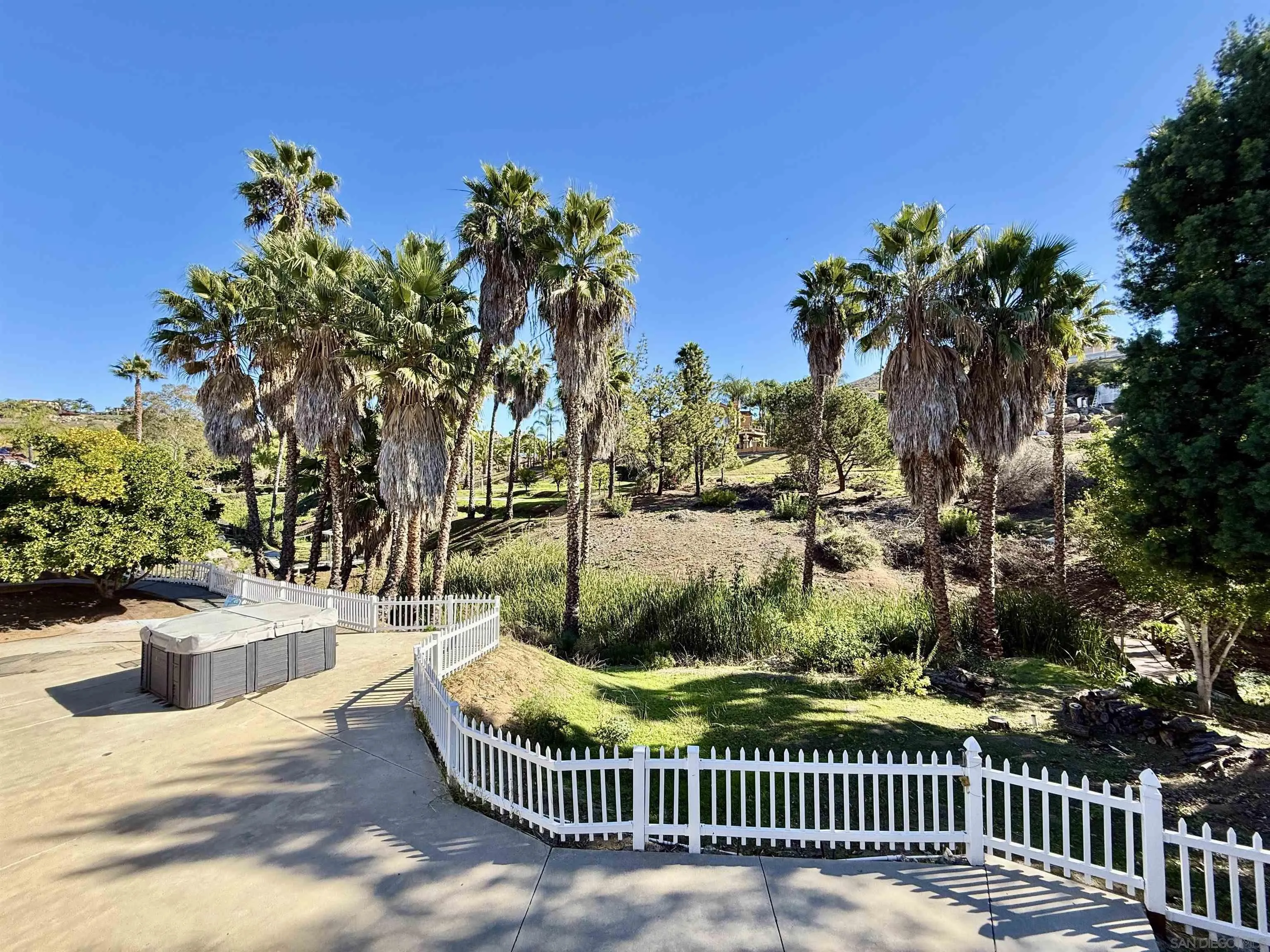 1423 Vista Grande Road El Cajon, CA 92019 - Photo 24 of 25 a view of a balcony with floor to ceiling window and wooden fence