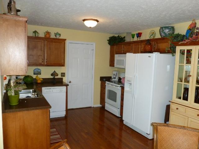 489 Skinner Flat Road Manchester, TN 37355 - Photo 8 of 20 Kitchen area with door leading to the one car garage