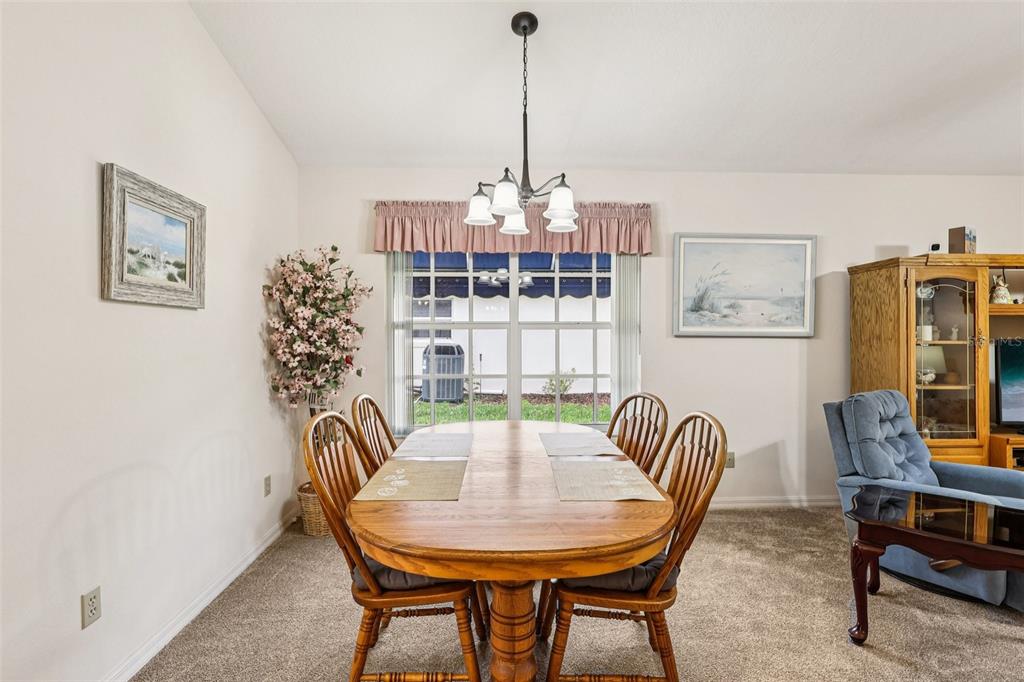 239 Juniper Way Tavares, FL 32778 - Photo 6 of 45 a view of a dining room with furniture window and outside view