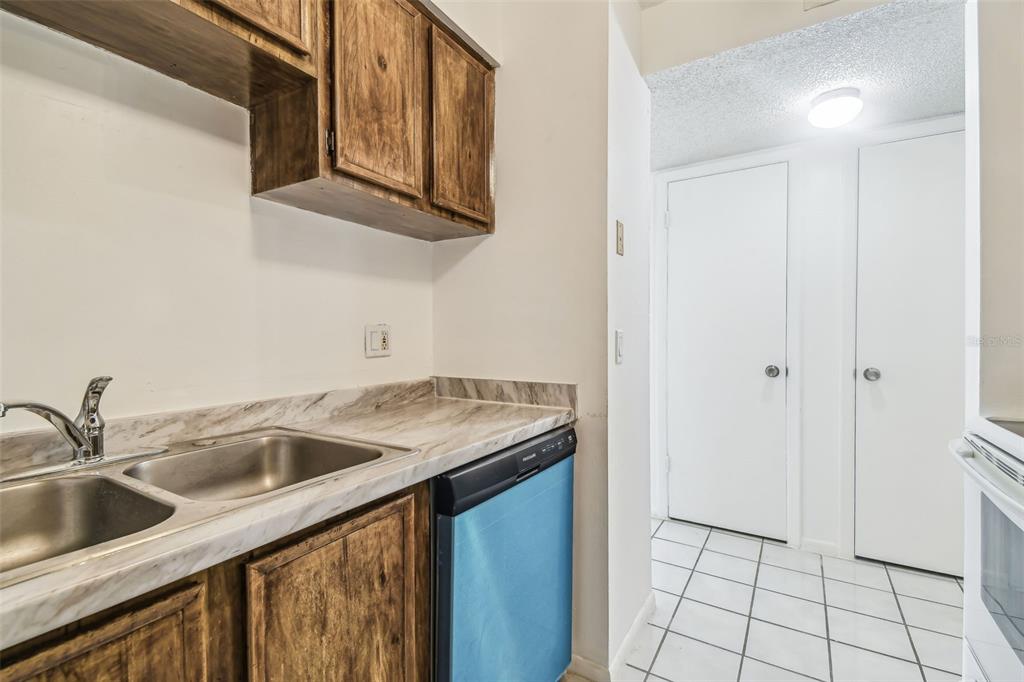 4208 Winding Moss Trail, Unit 102 Tampa, FL 33613 - Photo 12 of 27 a kitchen with a sink and cabinets