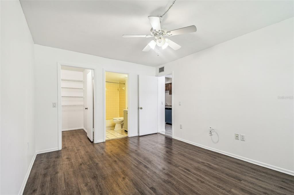 4208 Winding Moss Trail, Unit 102 Tampa, FL 33613 - Photo 15 of 27 a view of an empty room with wooden floor
