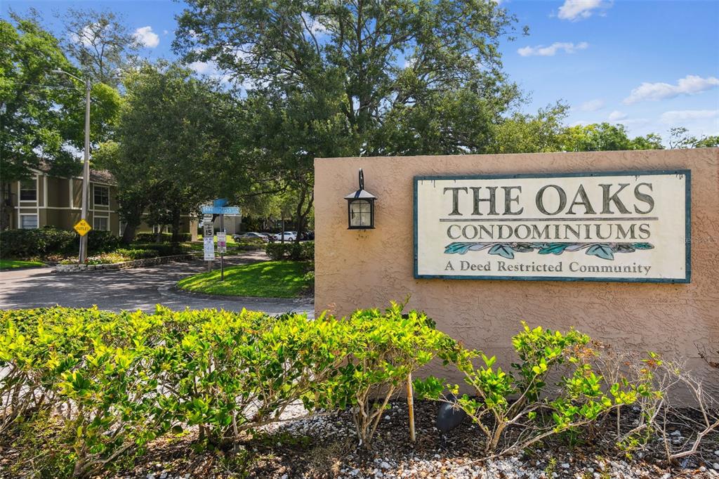 4208 Winding Moss Trail, Unit 102 Tampa, FL 33613 - Photo 27 of 27 a view of outdoor space with signage and flags