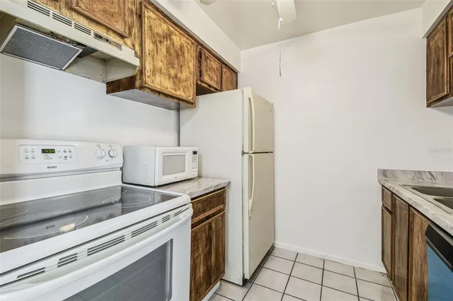 a kitchen with stainless steel appliances cabinets and a counter
