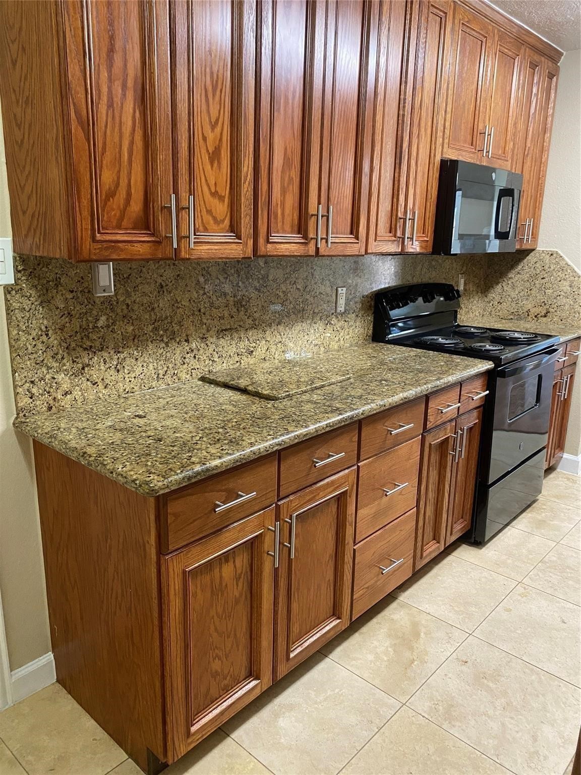 3226 Brookston Street Houston, TX 77045 - Photo 11 of 24 a kitchen with sink cabinets and appliances