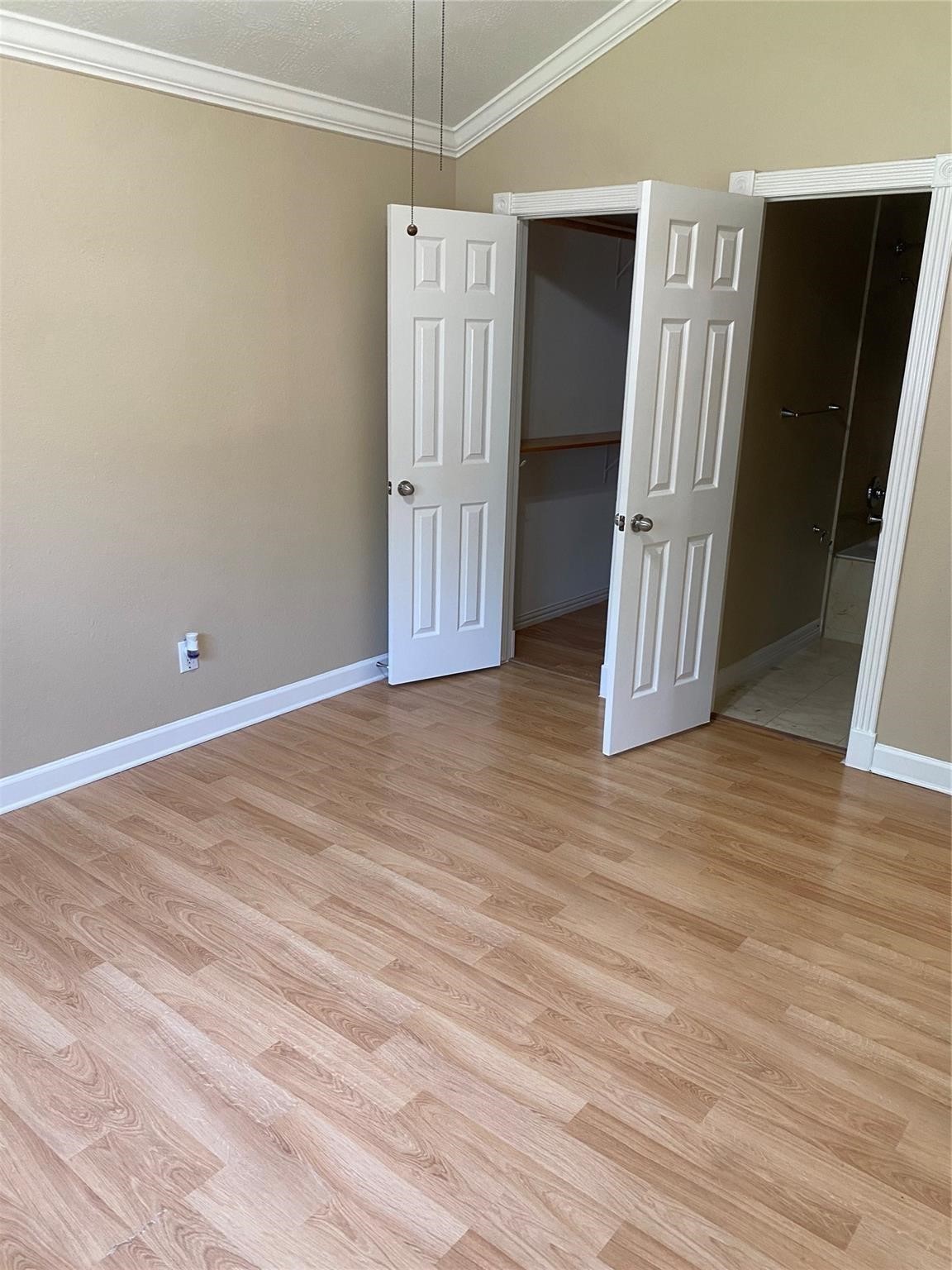 3226 Brookston Street Houston, TX 77045 - Photo 15 of 24 an empty room with wooden floor and entryway