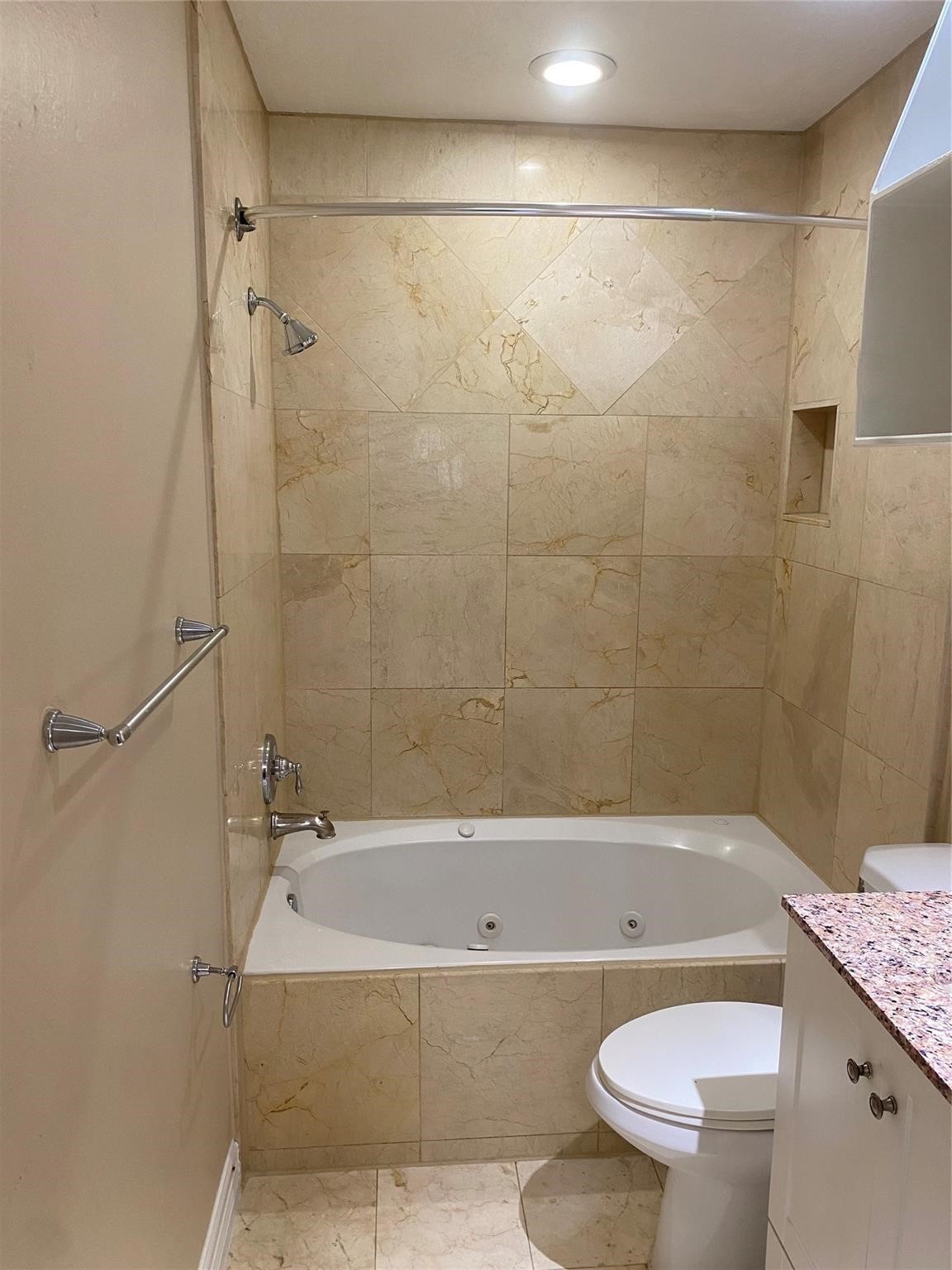 3226 Brookston Street Houston, TX 77045 - Photo 17 of 24 a bathroom with a granite countertop bathtub shower sink vanity and toilet