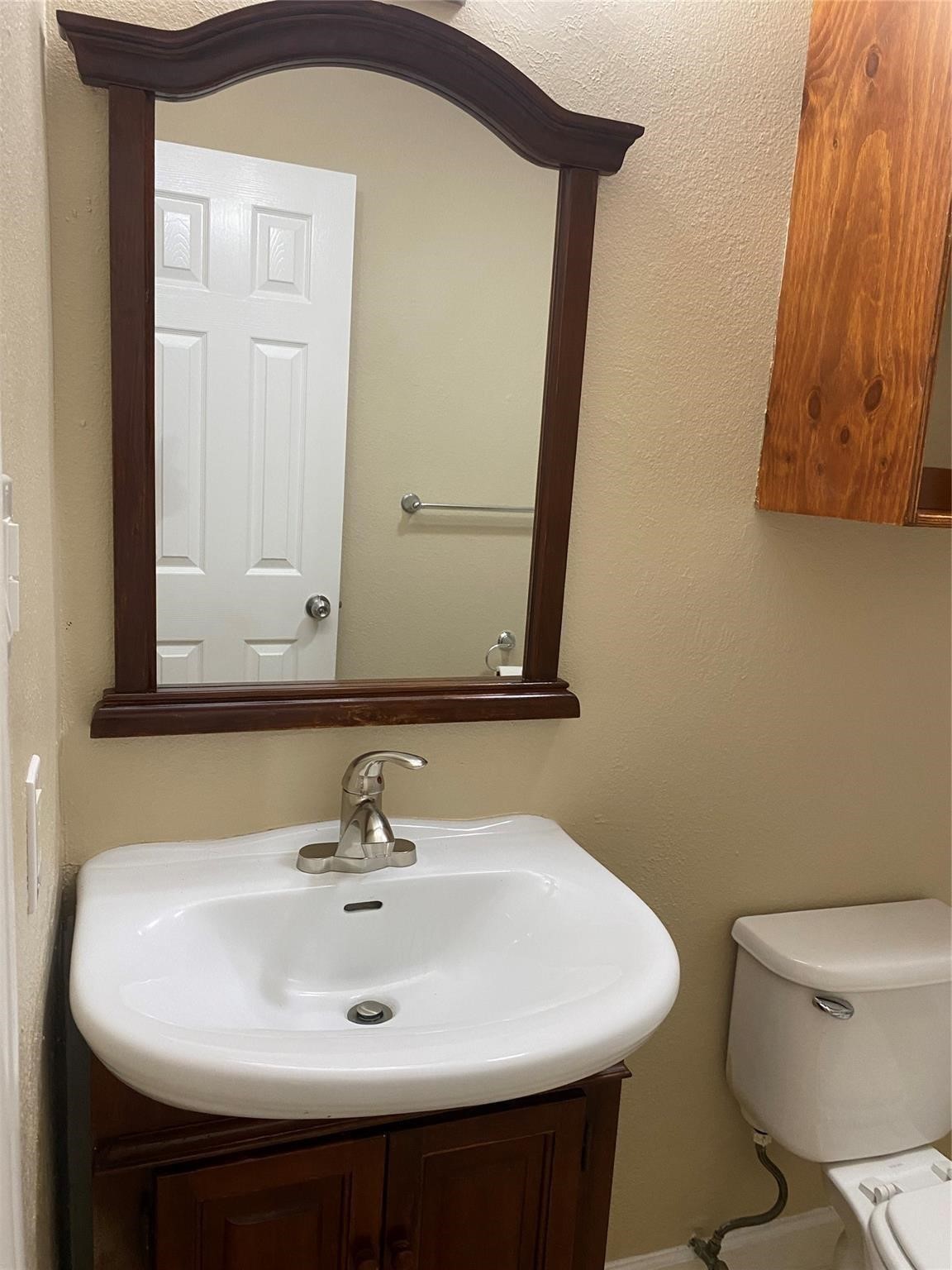 3226 Brookston Street Houston, TX 77045 - Photo 21 of 24 a bathroom with a sink and a toilet