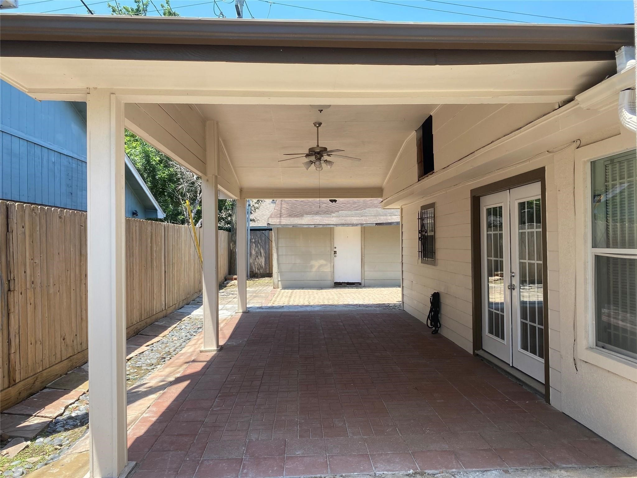 3226 Brookston Street Houston, TX 77045 - Photo 23 of 24 a view of a porch with wooden floor and fence