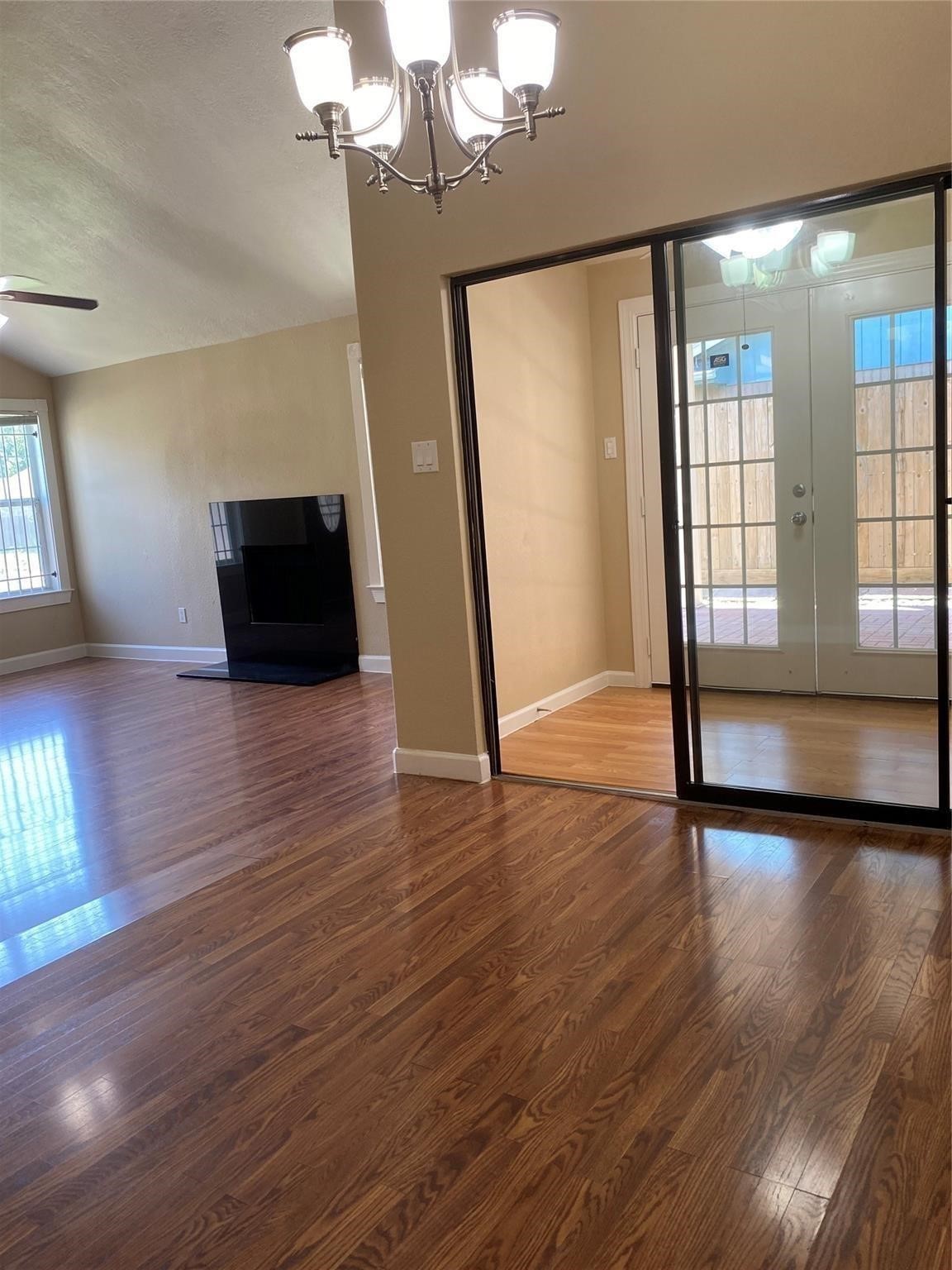 3226 Brookston Street Houston, TX 77045 - Photo 7 of 24 a view of empty room with wooden floor and fan