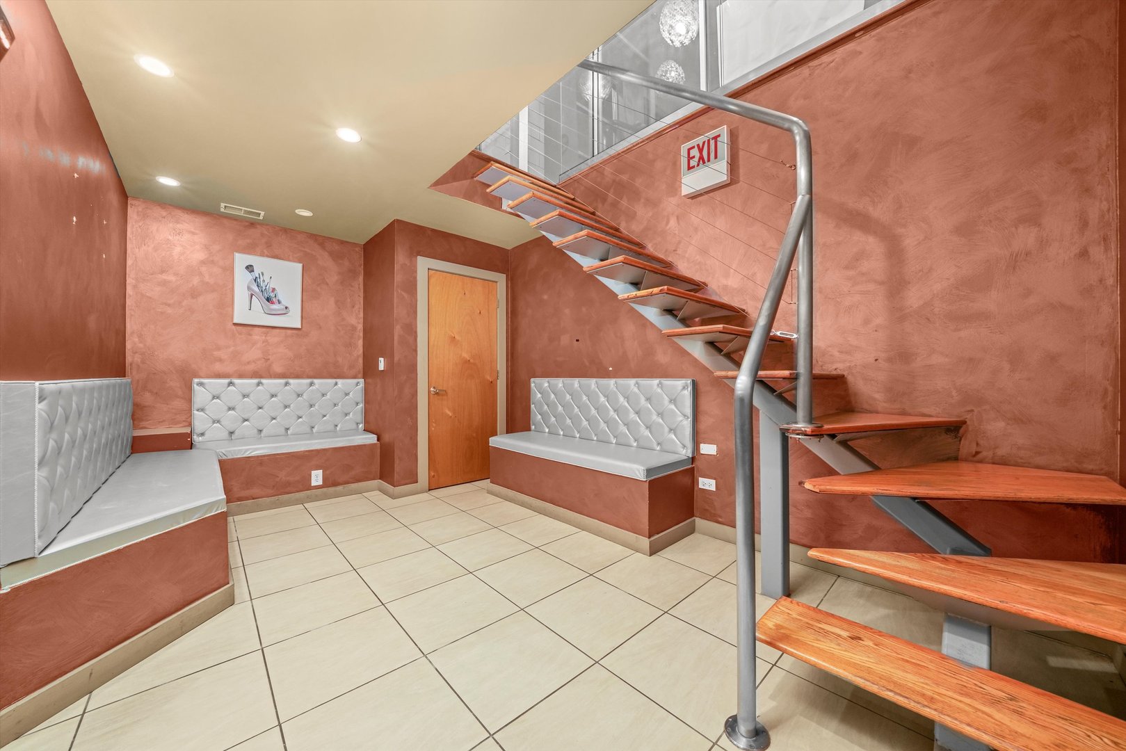 1412 West Division Street, Unit C1 Chicago, IL 60642 - Photo 19 of 28 a bedroom with a bed and a dresser with the shoe rack