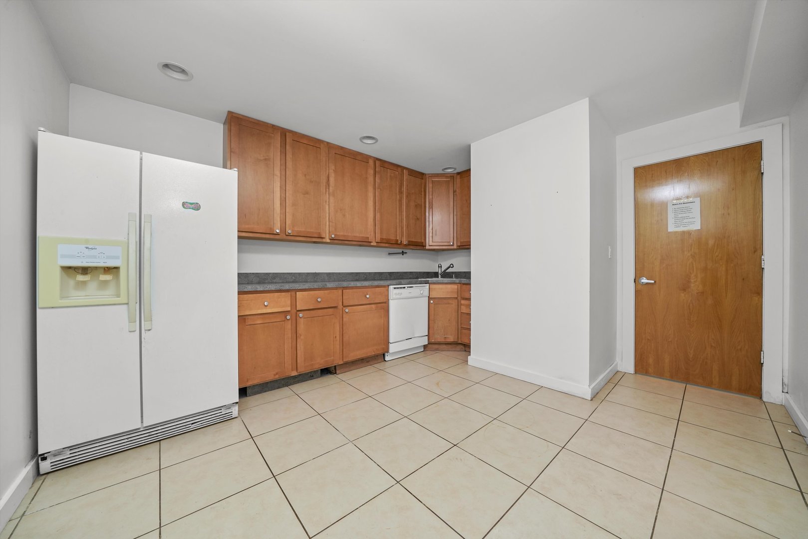 1412 West Division Street, Unit C1 Chicago, IL 60642 - Photo 22 of 28 a kitchen with cabinets and white appliances