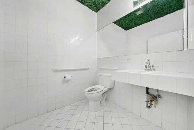 a room with pool table and glass door