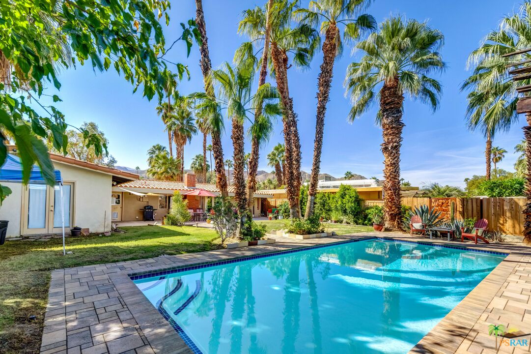 71770 San Gorgonio Road Rancho Mirage, CA 92270 - Photo 6 of 45 a view of swimming pool with lawn chairs and palm trees