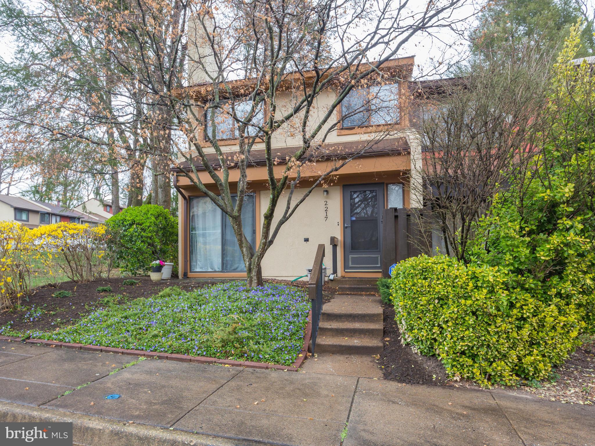 2217 Coppersmith Square Reston, VA 20191 - Photo 1 of 30 Exterior (Front) Sunny front with landscaping