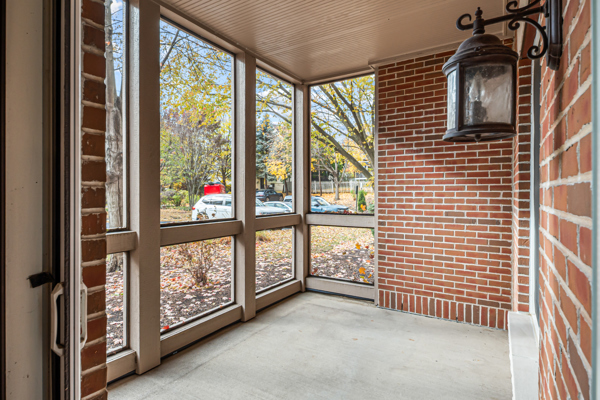 10 Ford Street, Unit 103 Geneva, IL 60134 - Photo 6 of 7 a view of front door with furniture