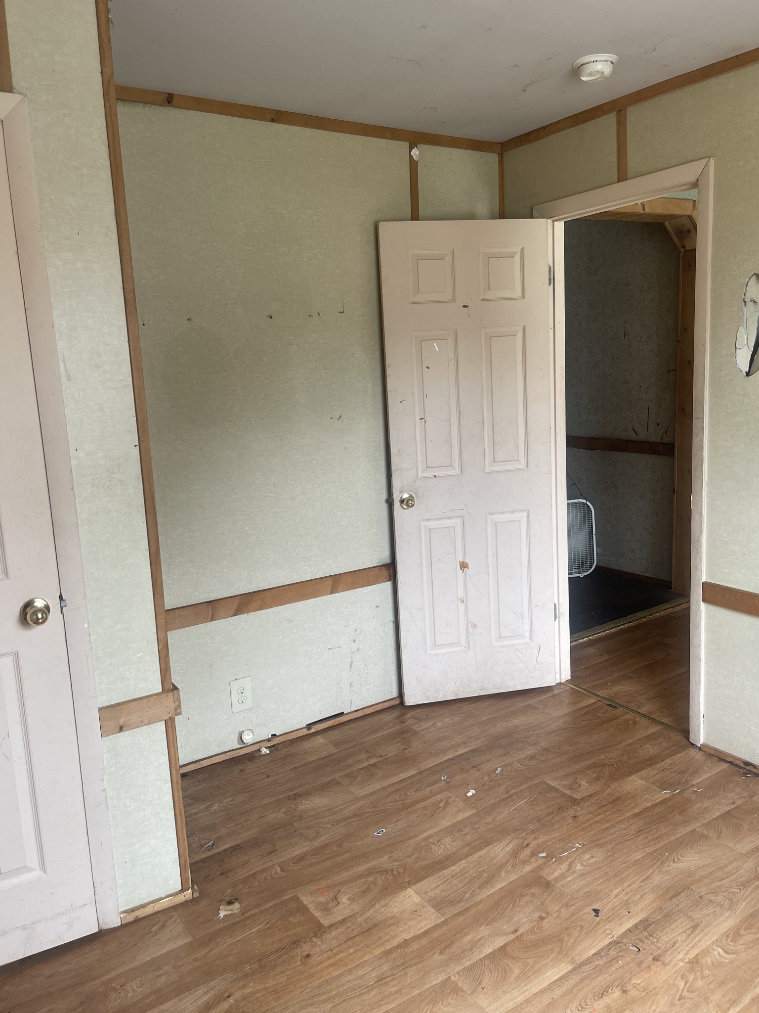 263 Reeves Street Lexington, TN 38351 - Photo 8 of 19 a view of empty room with wooden floor and cabinet