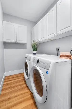 a utility room with sink dryer and washer