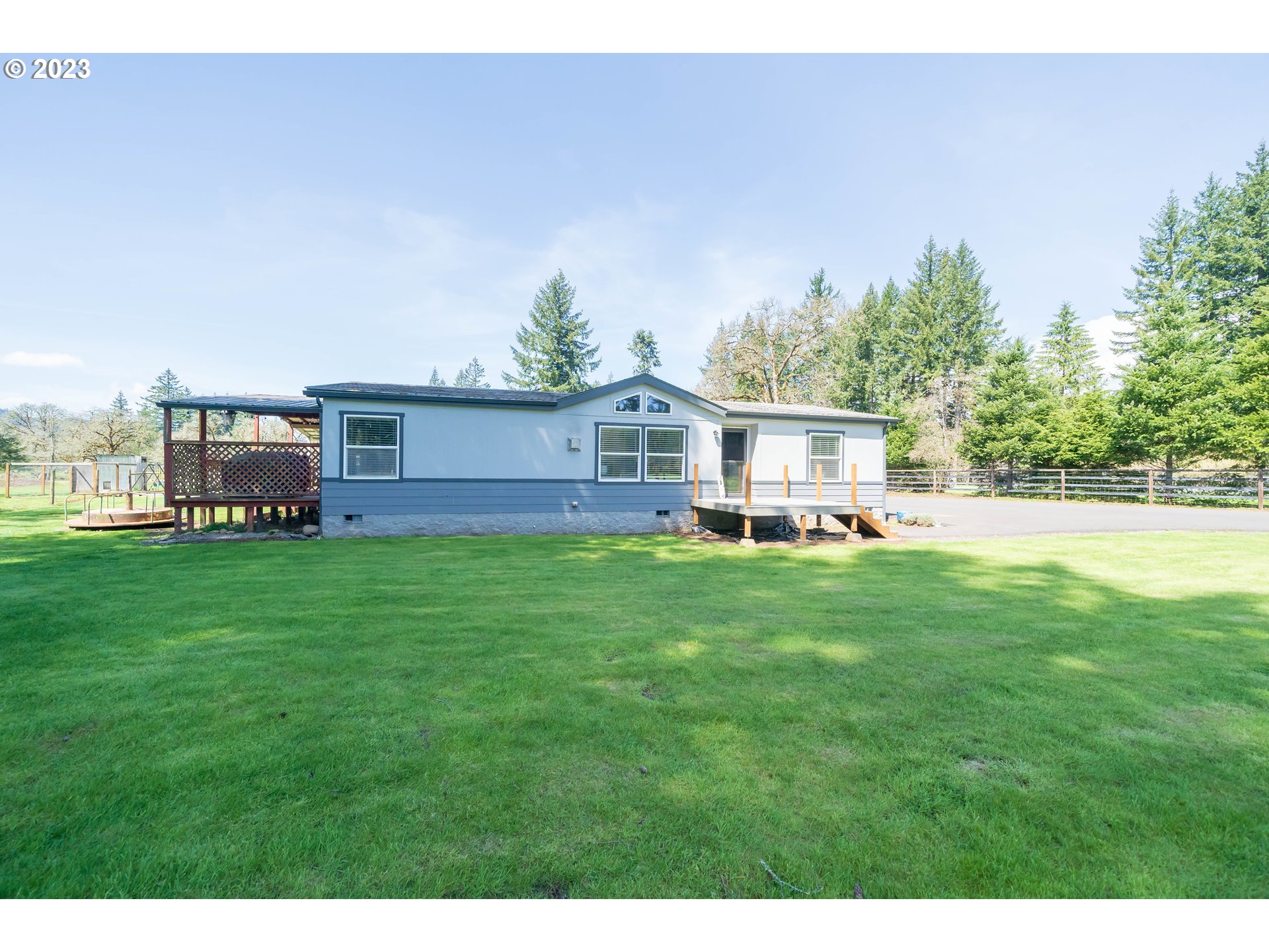 a view of house with backyard outdoor seating and green space