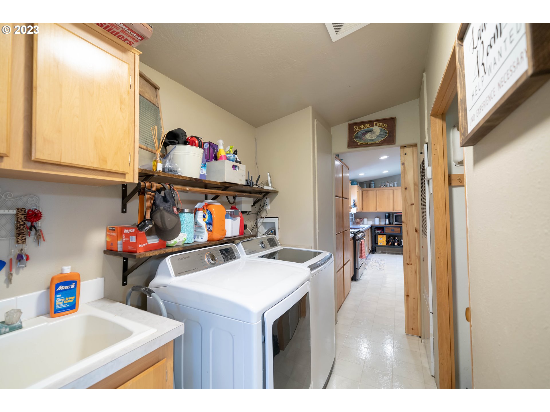 40766 North Mowitch Lyons, OR 97358 - Photo 17 of 31 a utility room with dryer washer and a view of living room
