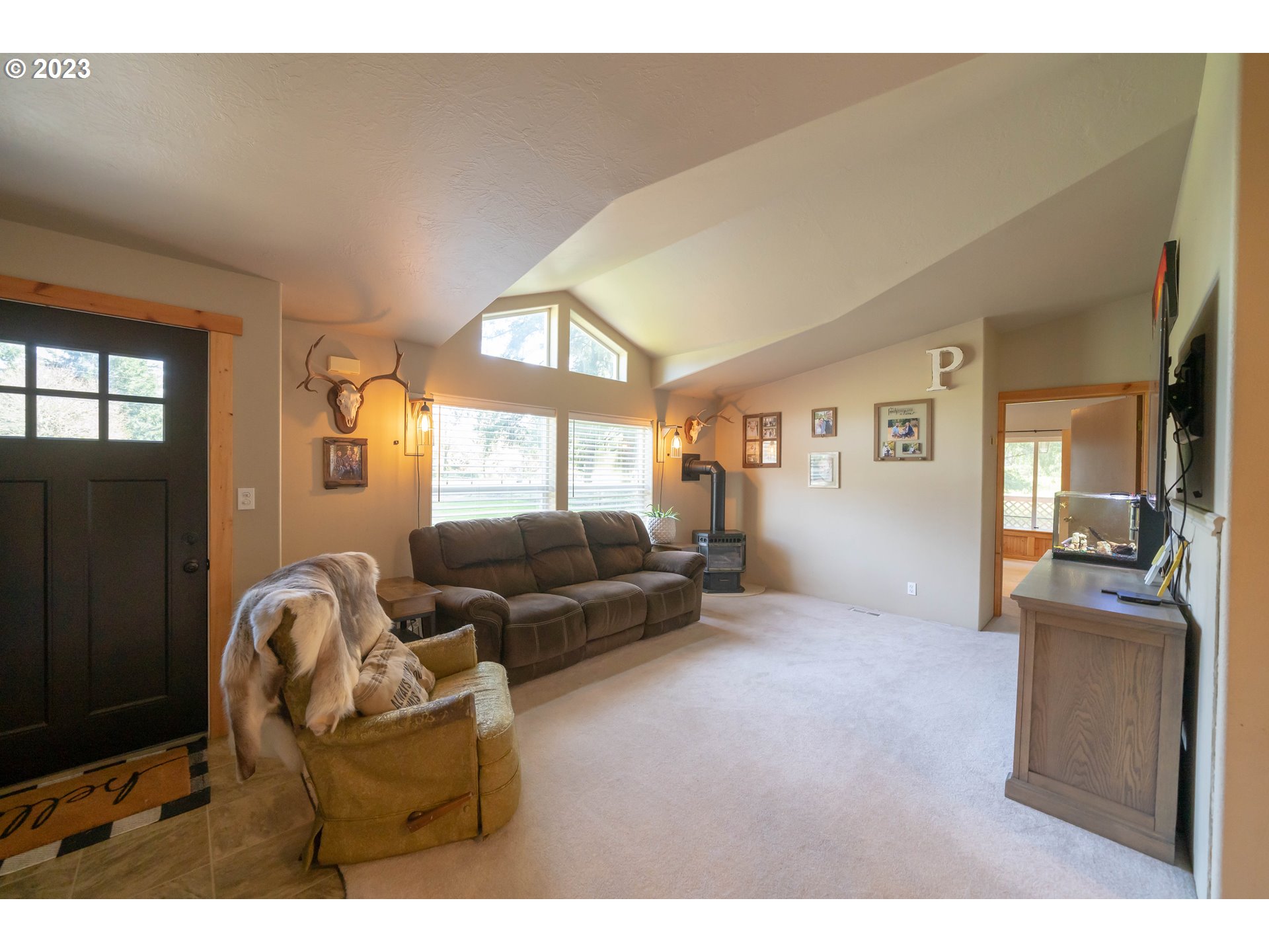 40766 North Mowitch Lyons, OR 97358 - Photo 6 of 31 a living room with furniture and a large window