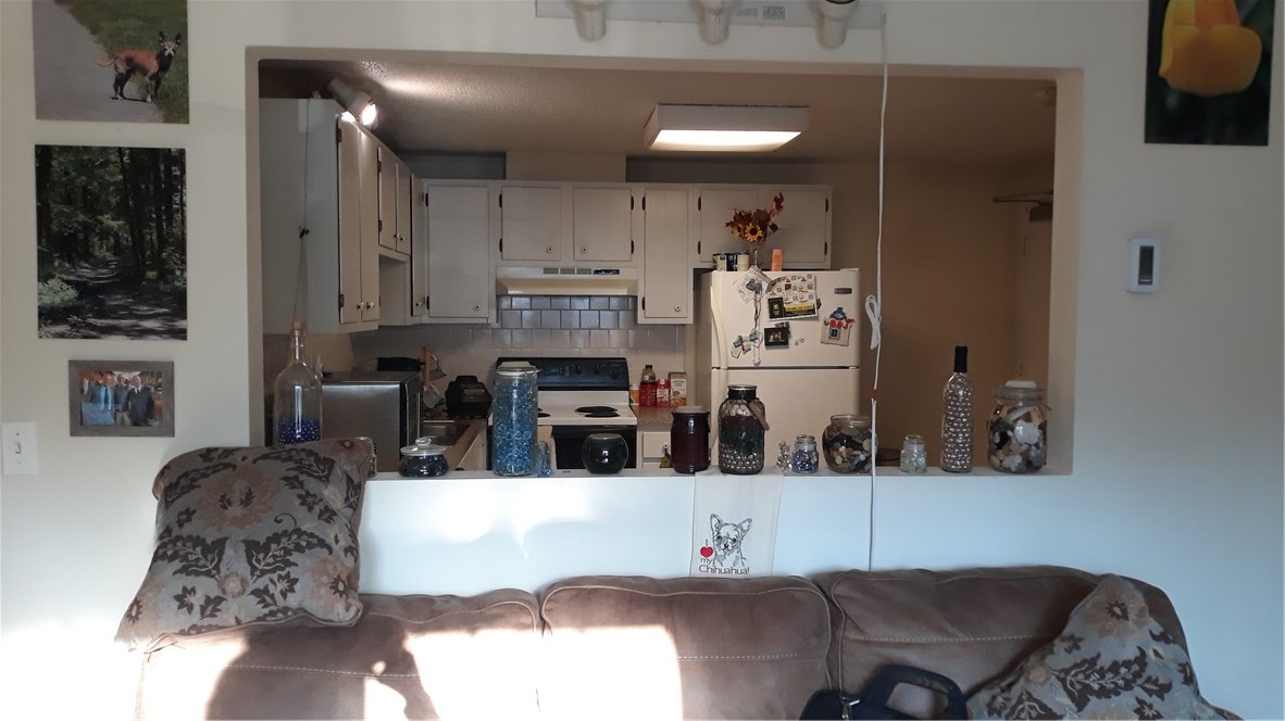 4080 Post Road, Unit 9 Warwick, RI 02886 - Photo 3 of 6 PASS THRU OPENING FROM LIVING ROOM INTO KITCHEN