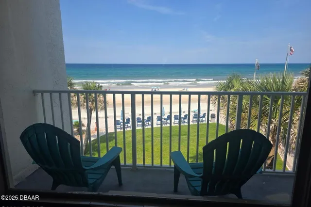 a view of a swimming pool with a terrace