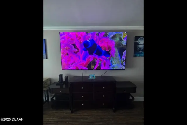 a living room with a couch and a dining table