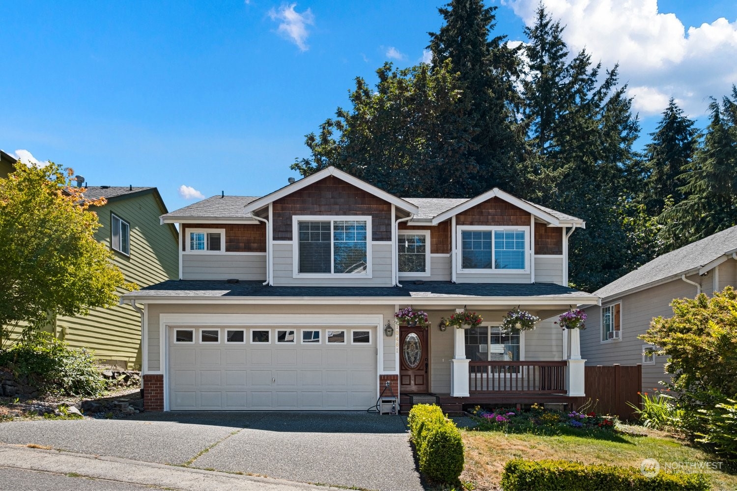 18481 114th Avenue Southeast Renton, WA 98055 - Photo 1 of 27 a front view of a house with a garden
