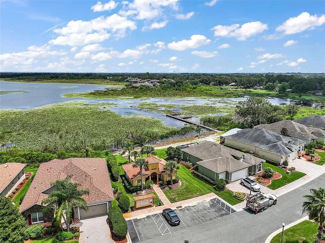 an aerial view of a house with a lake view